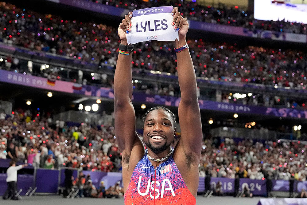 | Photo: AP/Matthias Schrader : Noah Lyles celebrates after winning the men's 100-meters final 